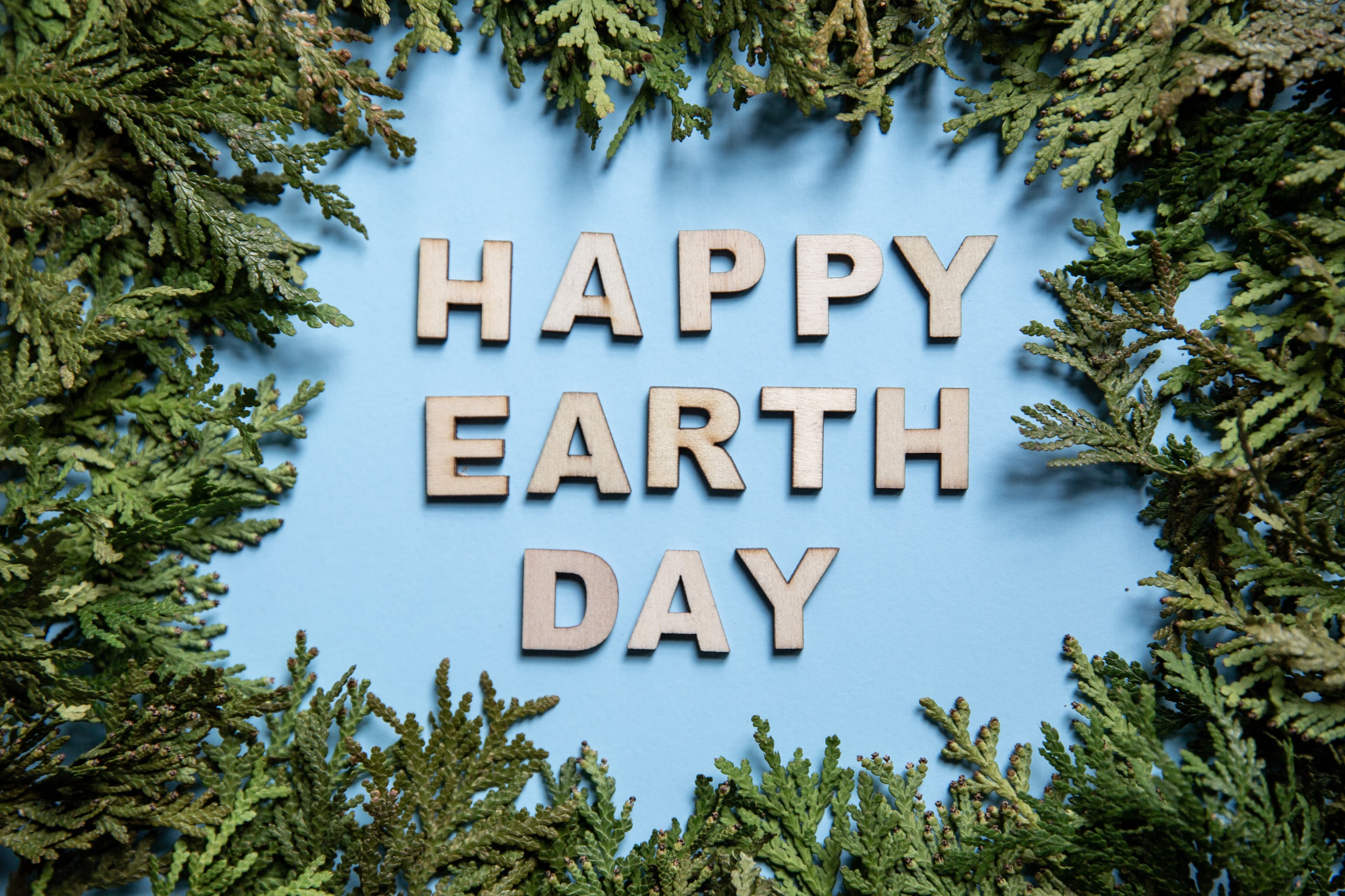 Happy Earth Day centerpiece made of reused tennis balls